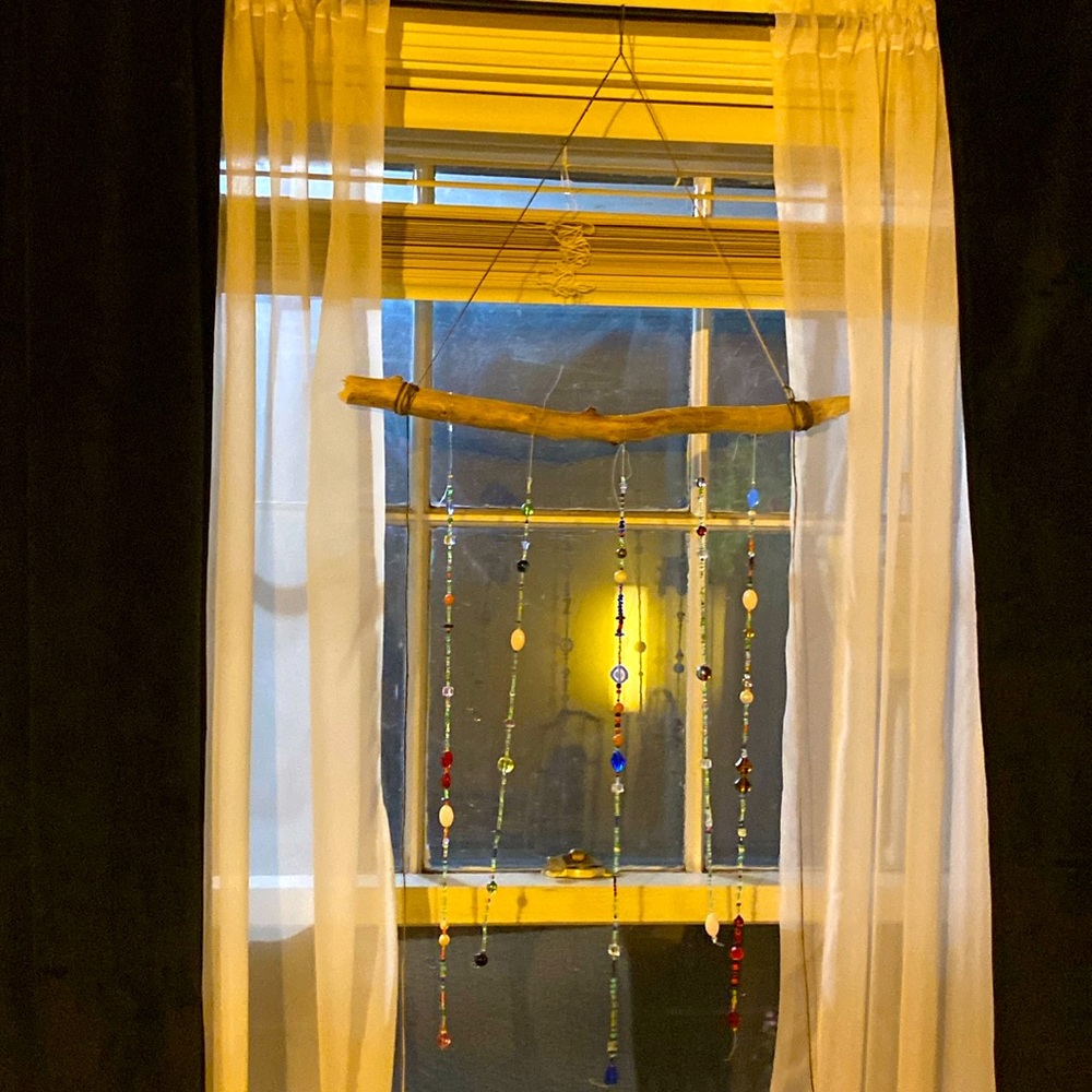Beaded window curtain made from glass beads, crystals, and gem stones.